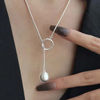 ball loop chain necklace silver loop pendant with hanging round charm worn on neckline