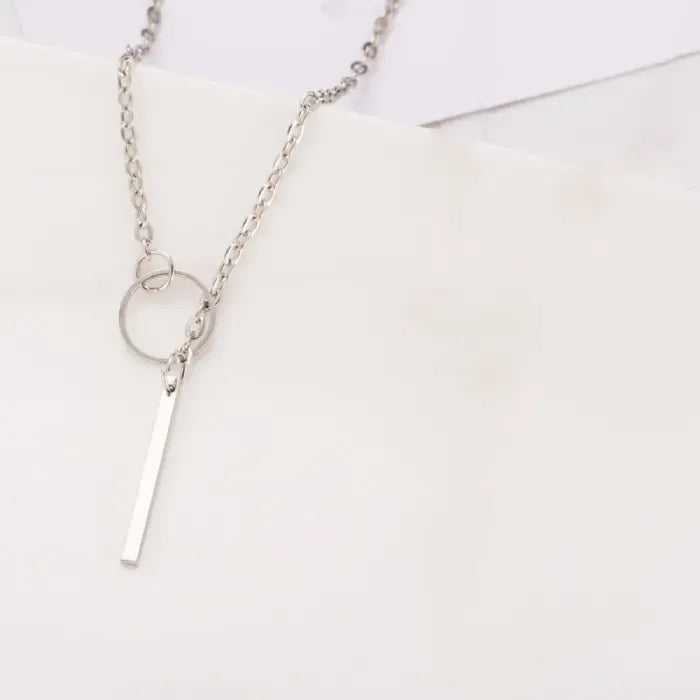 Bar Pendant Necklace simple silver chain with circle and bar pendant on white background