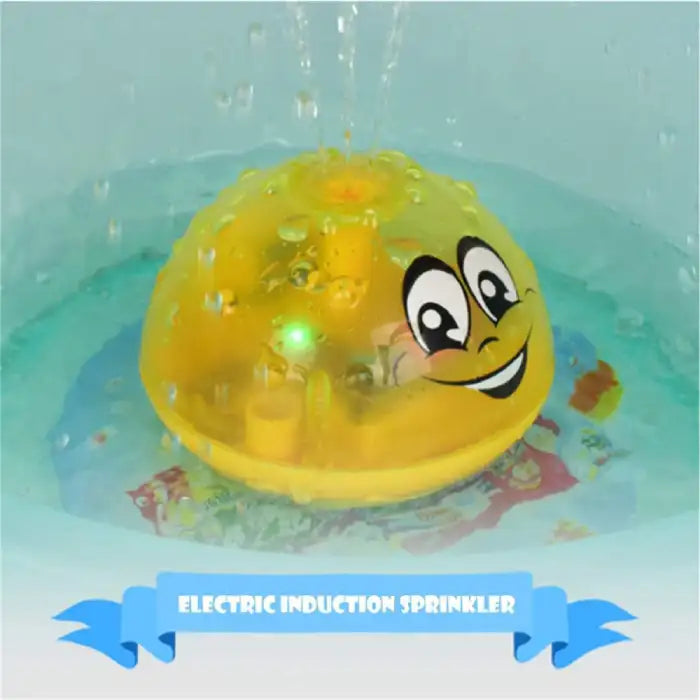 Bath toys with electric induction feature and smiling face design, spraying water while floating in the tub.