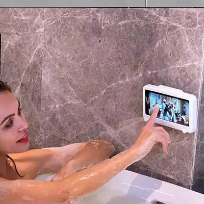 Woman enjoying entertainment on waterproof screen mounted in bathroom, revolutionizing relaxation during bath time.