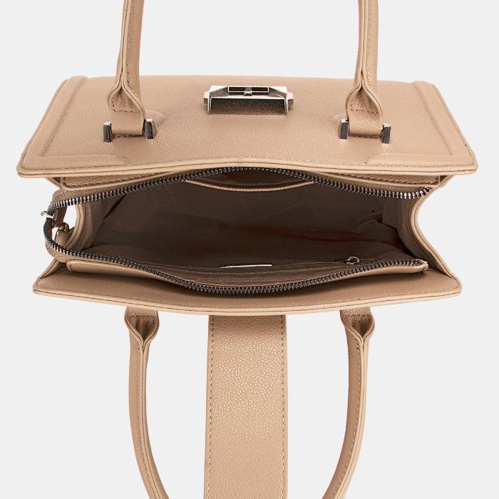 Inside view of beige leather bag showing spacious brown-lined interior with multiple compartments and zip closure