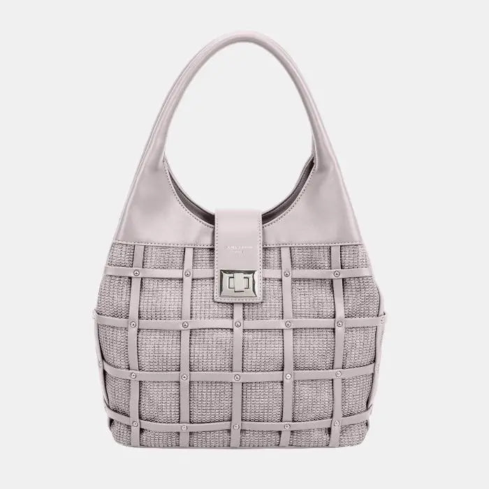 Chic beige leather handbag with woven texture, silver studs, and metal clasp. Versatile neutral color for any outfit.