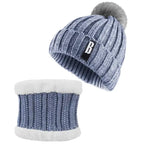 Blue Bennie Hat Scarf Set with gray pompom and white fleece lining for soft winter comfort.