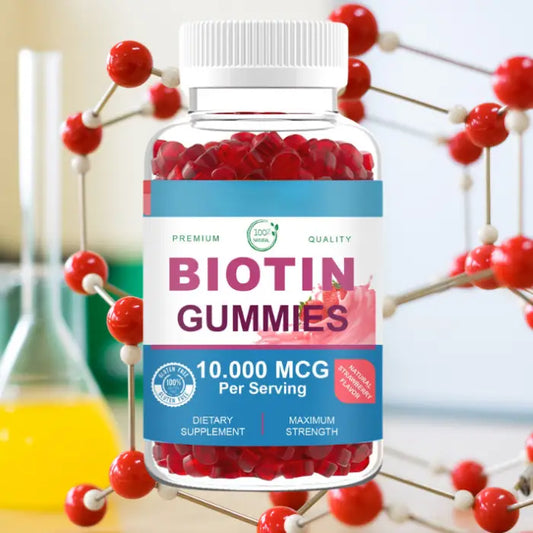 Biotin gummies supplement bottle with red gummies inside.