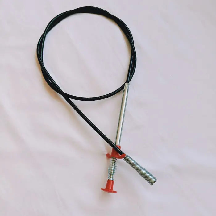 Kitchen pipe dredging tool with a black flexible cable and red handle.