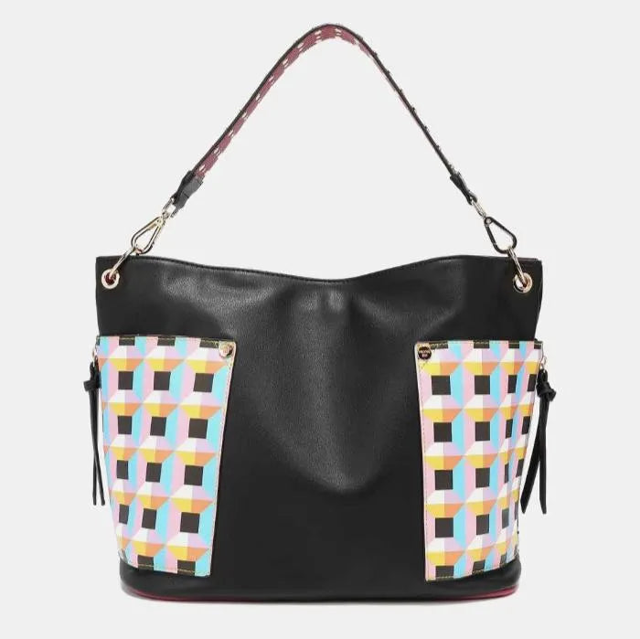 Versatile black leather bag with pastel geometric panels, burgundy trim, and studded strap detailing