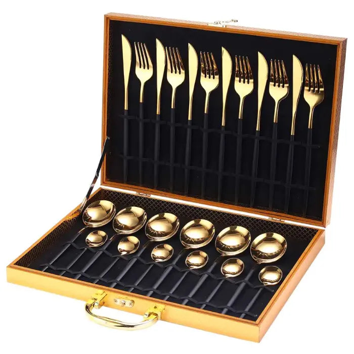 Modern black-handled gold flatware set in premium wooden display case