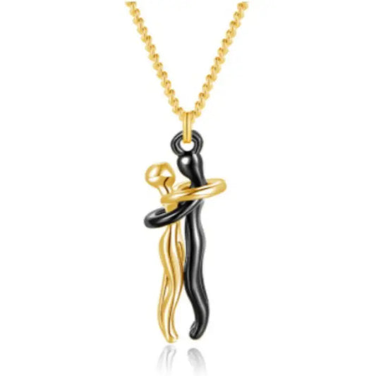 Elegant black and gold couple hug pendant necklace with a modern and romantic abstract design.