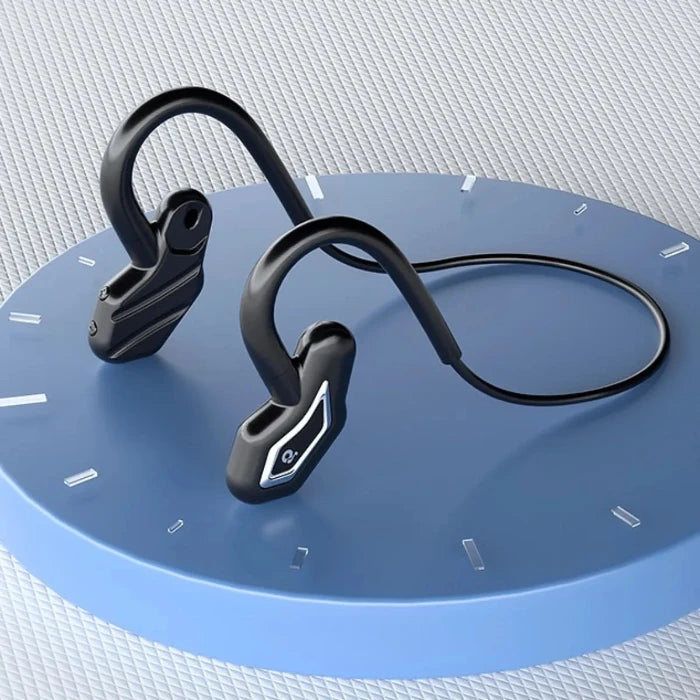 Black bone conduction headphones on blue circular platform with clock markings, showcasing wireless design