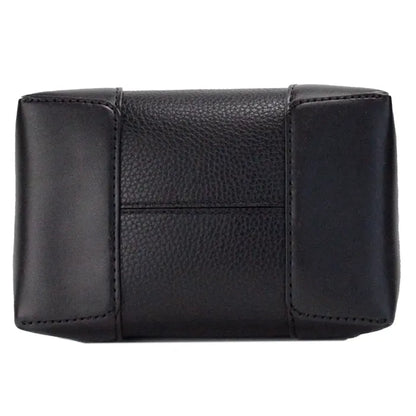 Bottom view of a black leather handbag showing quality craftsmanship and durable base.