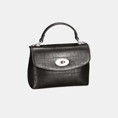  Black crocodile-textured leather handbag with a silver clasp, designed for timeless and versatile fashion.