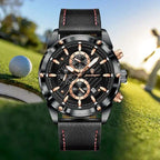 High-end leather watch with a black strap, stainless steel case, and chronograph design, displayed on a golf course background.