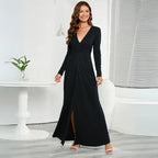 Black long sleeve V-neck maxi dress with a front slit and ruched waist detail.