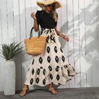 Black maxi dress boho pattern tiered hem in beige with puff sleeves, perfect casual outfit for warm days.