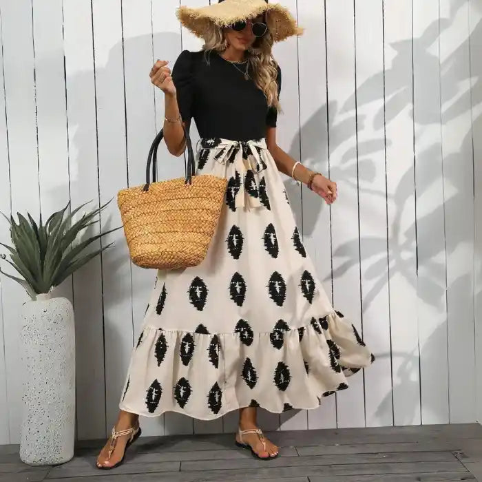 Black maxi dress boho pattern tiered hem in beige with puff sleeves, perfect casual outfit for warm days.