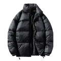  Black oversized puffer jacket horizontal quilted with high collar, zipper open showing interior, elastic cuffs.