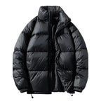  Black oversized puffer jacket horizontal quilted with high collar, zipper open showing interior, elastic cuffs.