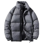 Black oversized puffer jacket horizontal quilted open view, revealing gray lining, side pockets, and insulated design.