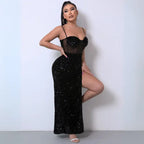 Black sequin mesh party dress with a high slit, sheer corset bodice, and spaghetti straps, styled elegantly.