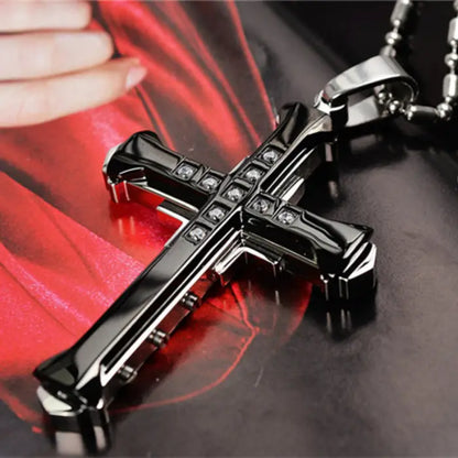 Black stainless steel cross pendant with crystal accents, a modern design for men's religious necklaces.