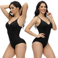 Black tummy control shapewear suit with seamless construction designed for workout performance and post-surgery compression support.