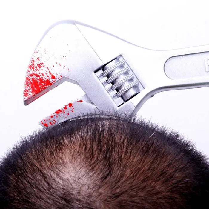 Close-up of bloody weapon headband Halloween costume with wrench through head.
