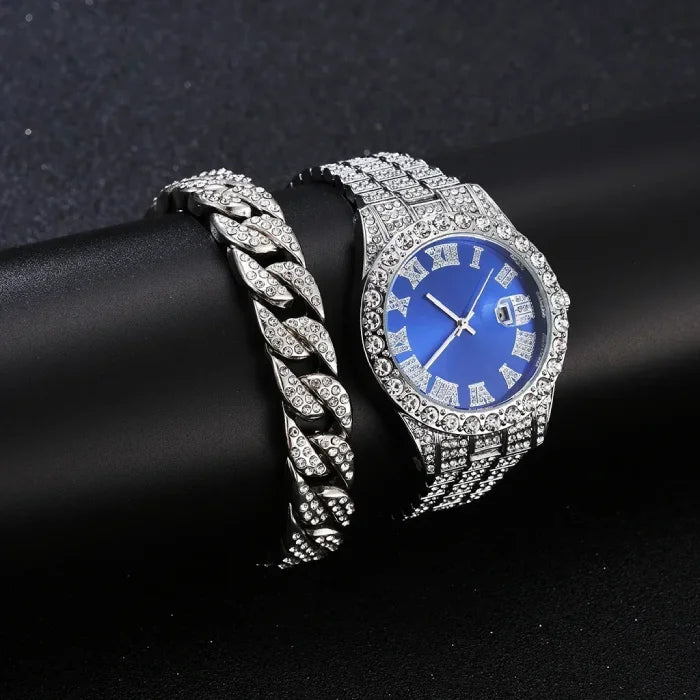 Silver watch featuring blue dial and elaborate crystal design, presented on black.