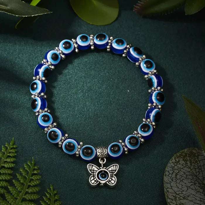 Blue evil eye bracelet with a butterfly charm for Turkish protection and transformation energy.