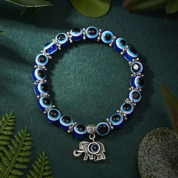 Blue evil eye bracelet with an elephant charm, symbolizing luck and Turkish protection.