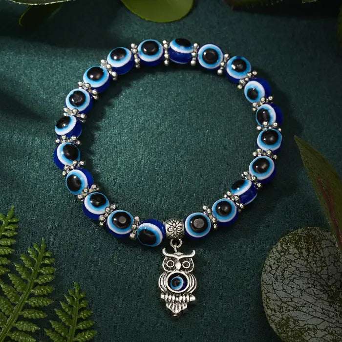 Blue evil eye bracelet with an owl charm symbolizing wisdom and Turkish protection.