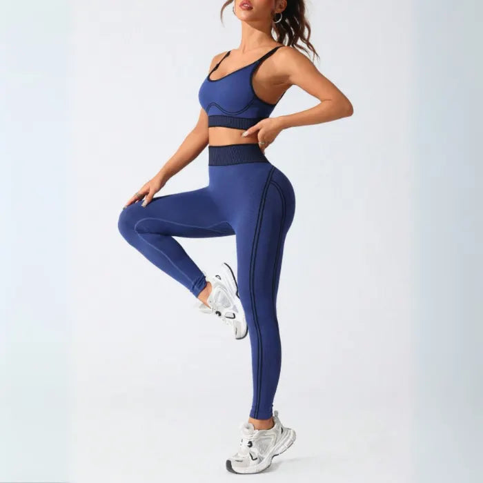 Seamless navy athletic set with side profile view, featuring high-waisted compression leggings and matching sports bra