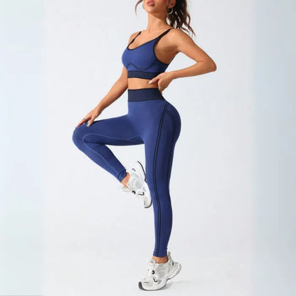 Seamless navy athletic set with side profile view, featuring high-waisted compression leggings and matching sports bra