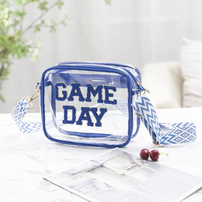 Clear stadium bag with blue Game Day lettering styled with cherries and marble backdrop for game day accessories