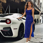Blue gown with shimmering sequins paired with luxury white sports car, showcasing elegant evening attire with side slit.