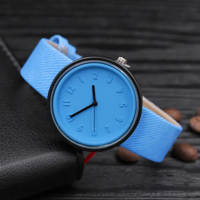 Modern blue wristwatch with minimalist design and comfortable strap for everyday casual wear.