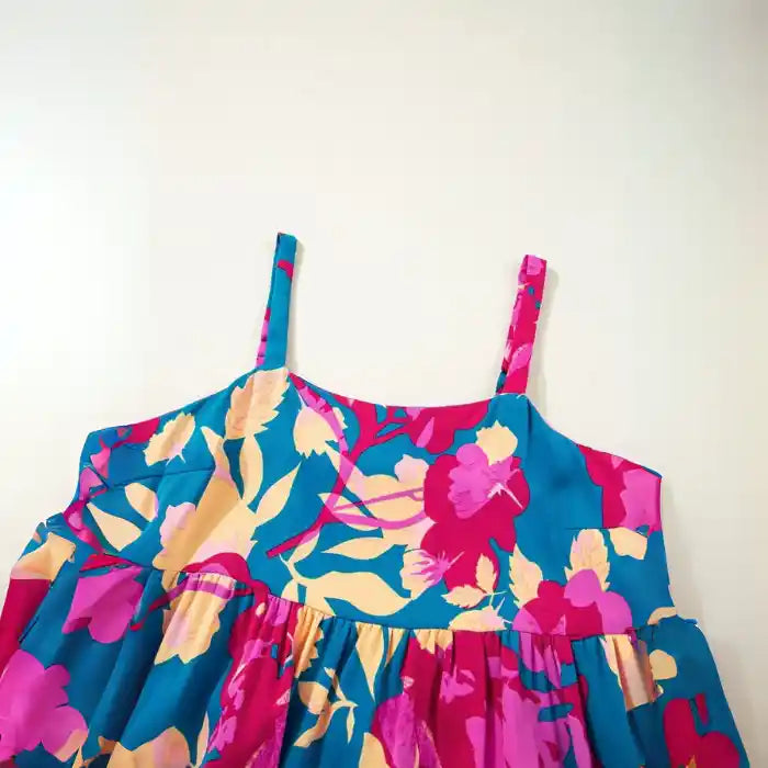 Blue pink floral maxi dress close‑up of square neckline and vibrant floral pattern.