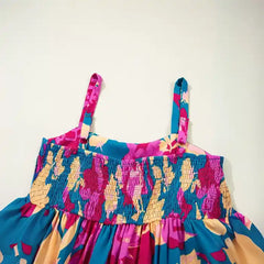 Blue pink floral maxi dress detail with smocked waist and adjustable shoulder straps.