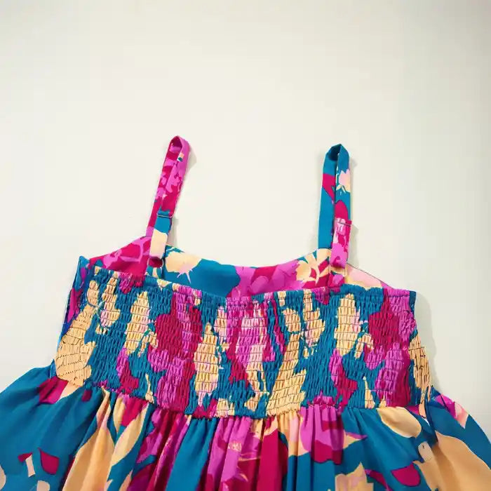 Blue pink floral maxi dress detail with smocked waist and adjustable shoulder straps.