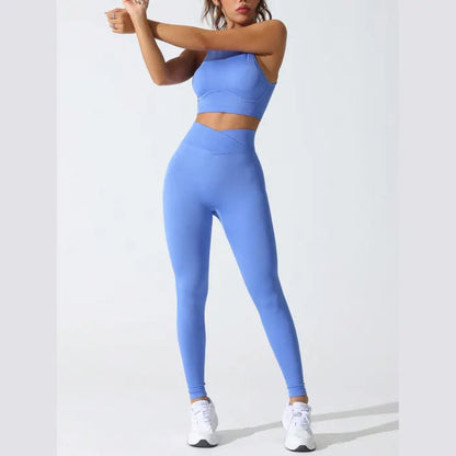 Stretching in blue seamless activewear set, emphasizing flexible and breathable material for optimal performance.