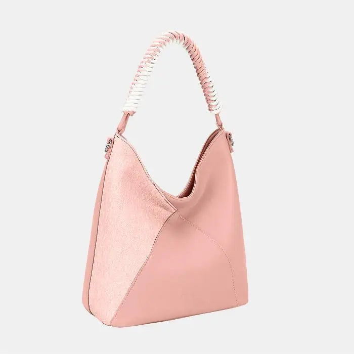 Blush pink hobo bag with braided handle, showcasing two-tone design with suede and leather panels