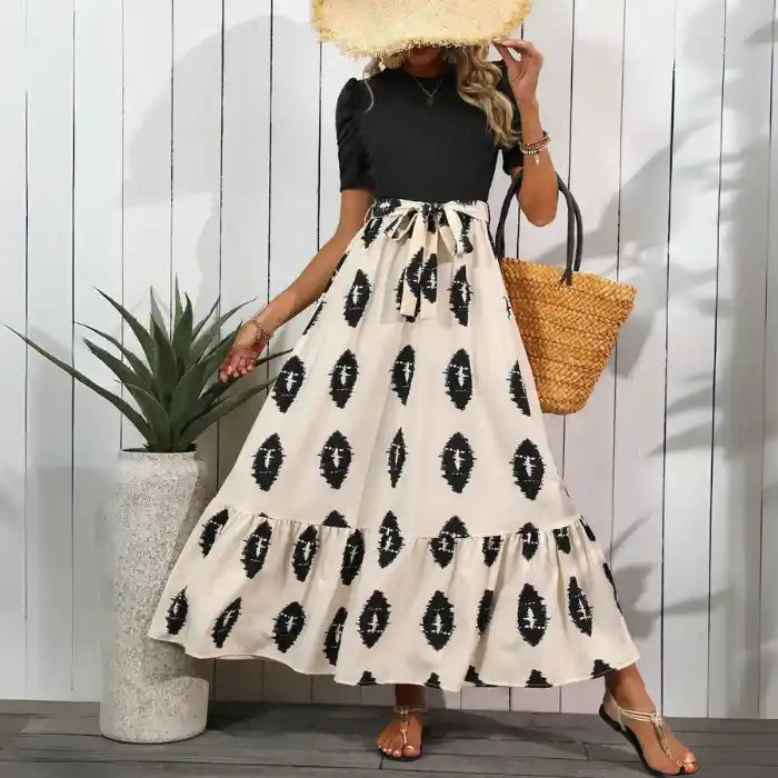Boho maxi dress black beige pattern tied waist fluttering tiered hem perfect for summer outings.