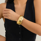 bracelet fashionable hammered gold wide bangle on wrist