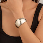 bracelet fashionable sculpted silver bangle styled with black tank
