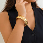 bracelet fashionable wide gold bangle worn with black top