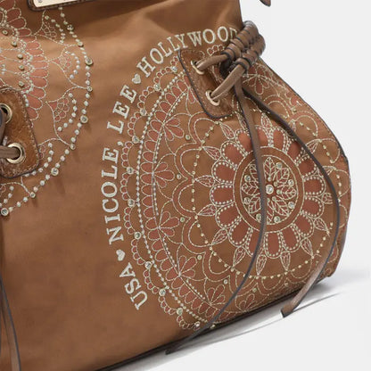 Brown handbag with intricate embroidery design, featuring floral patterns and stylish accents.