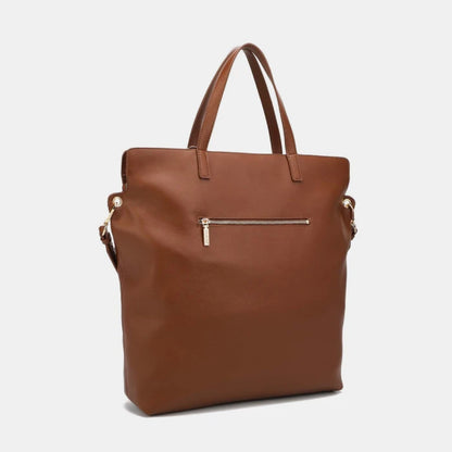 Classic brown leather tote bag back view showing exterior zipper pocket and clean minimalist design details