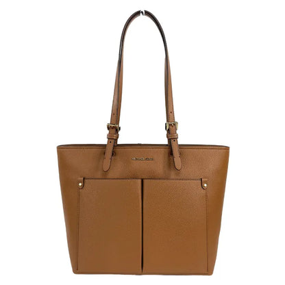 Michael Kors Brown leather tote bag with front pockets and adjustable straps, perfect for stylish handbags.