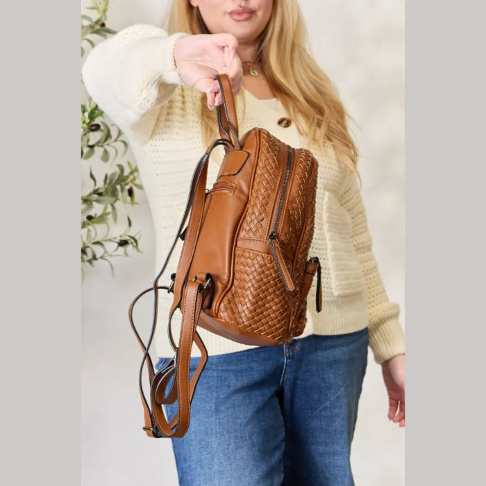 Side view of brown woven leather backpack with adjustable straps and stylish detailing.