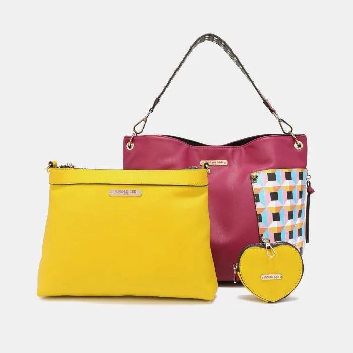 Designer handbag set featuring burgundy tote with geometric panels, yellow clutch and matching heart-shaped coin purse