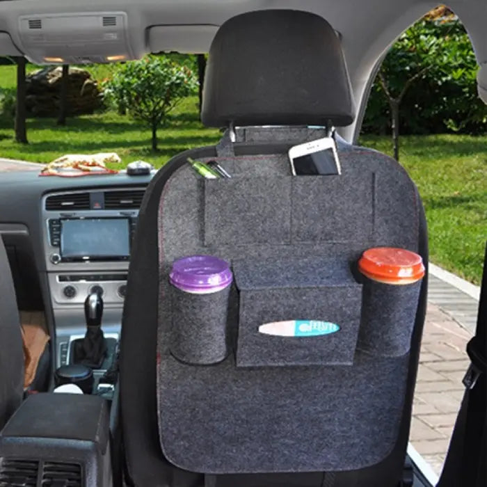 Car-back-seat-organizer in dark felt with phone, pens, and cup storage on front seat back.